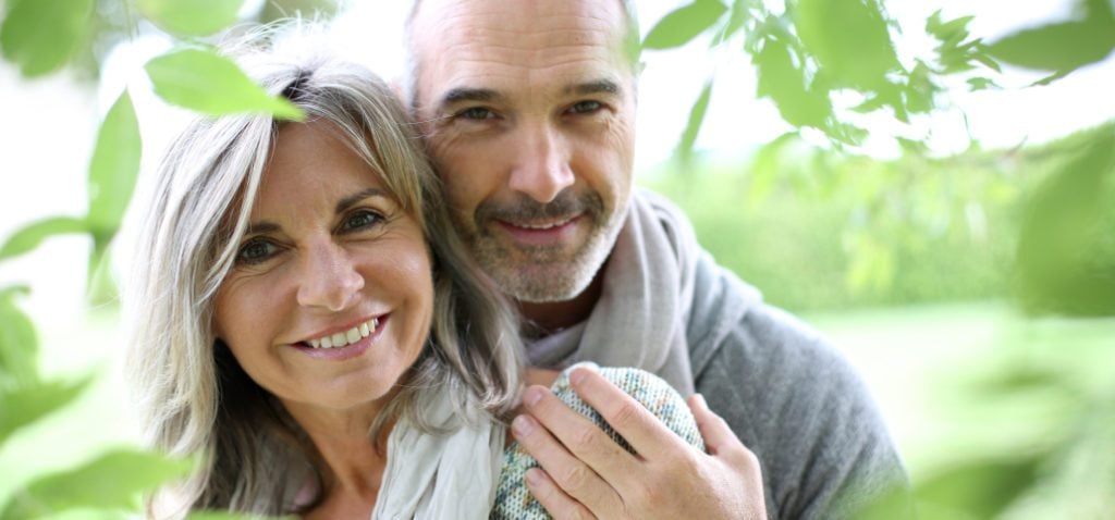 Couple embracing in a forest