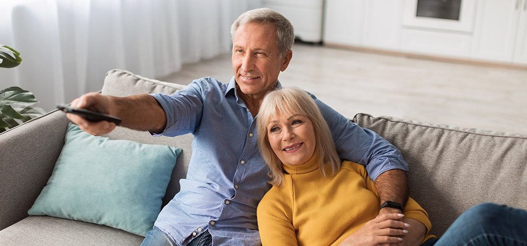 Senior couple watching TV