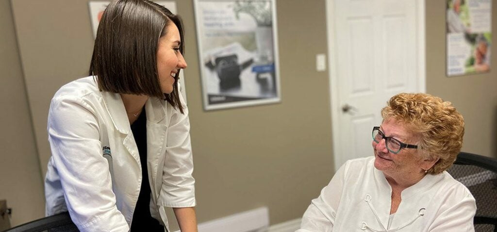 Audiologist having a discussion with a patient