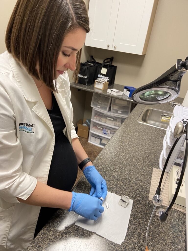 Technician working on hearing aids in Alliston Ontario