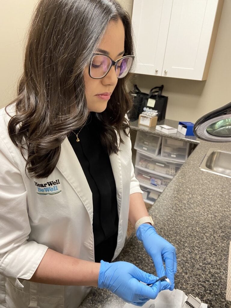 Technician working on hearing aids in Alliston Ontario